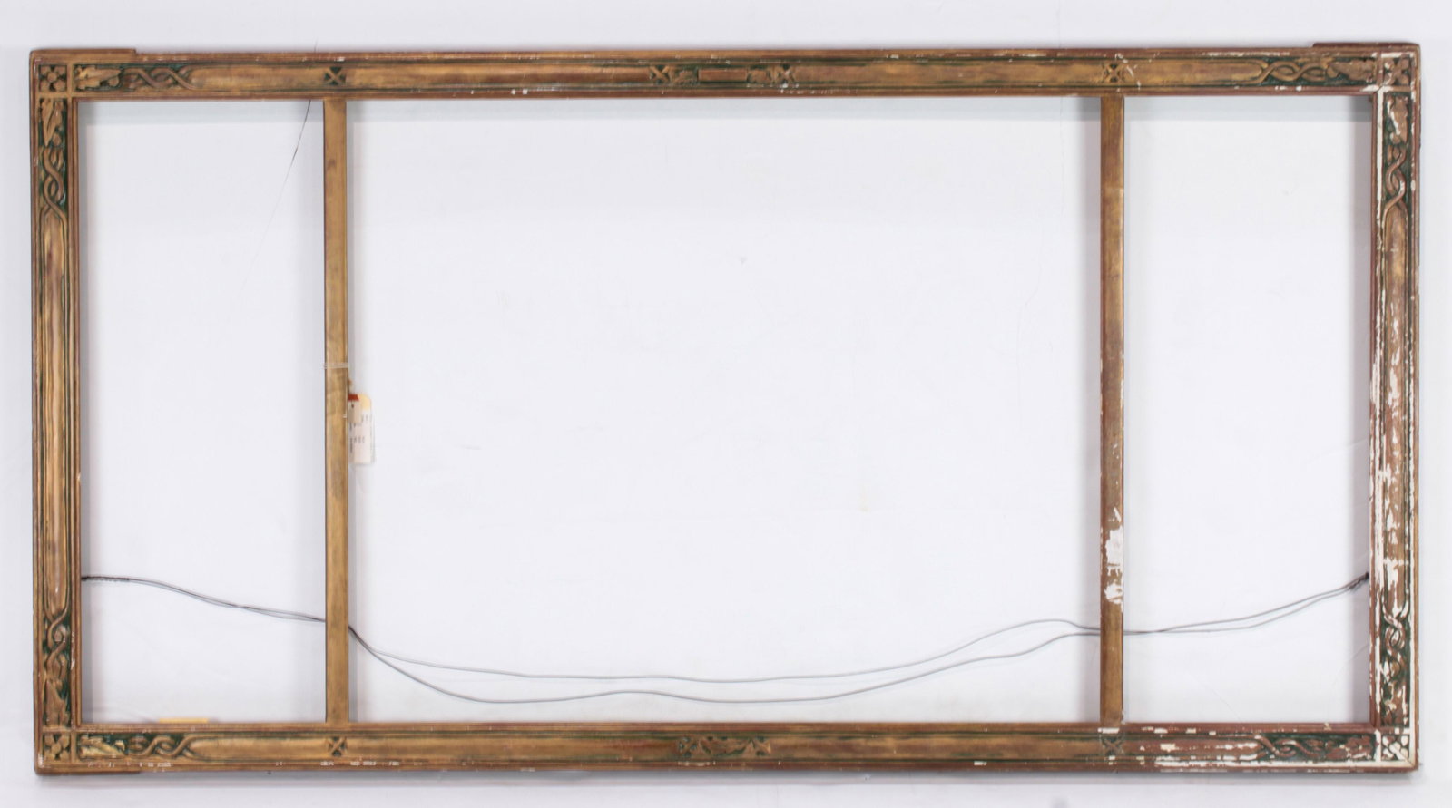 A hand carved Arts and Crafts triptych frame executed: A hand carved Arts and Crafts triptych frame executed by Karl Schmidt (American 1890-1962), executed in three parts, and signed at center bottom, overall 29"h x 56"w the sides rabbet 25"h x 10"w, cent