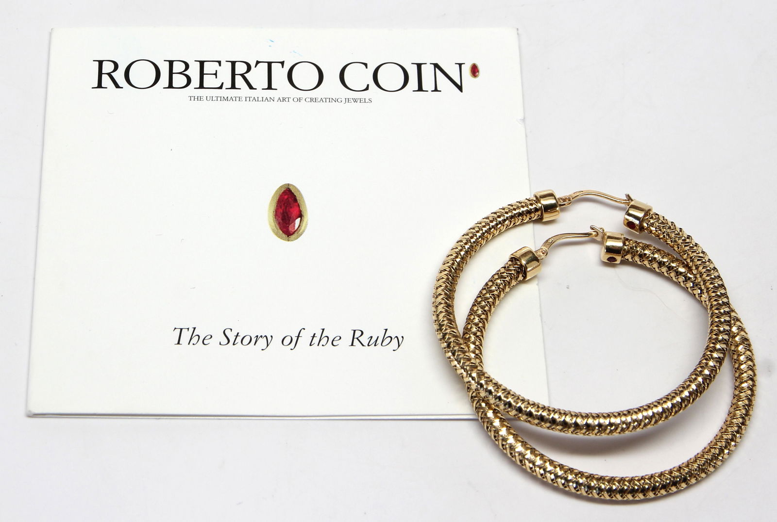 Pair of Roberto Coin 18k yellow gold hoop earrings: Pair of Roberto Coin 18k yellow gold hoop earringsThe 18k yellow gold, woven hoops, measuring approximately 3.0 mm in width and 40 mm internal diameter (marked: 18Kt, ITALY, * 122-6 VI, inset with (2)