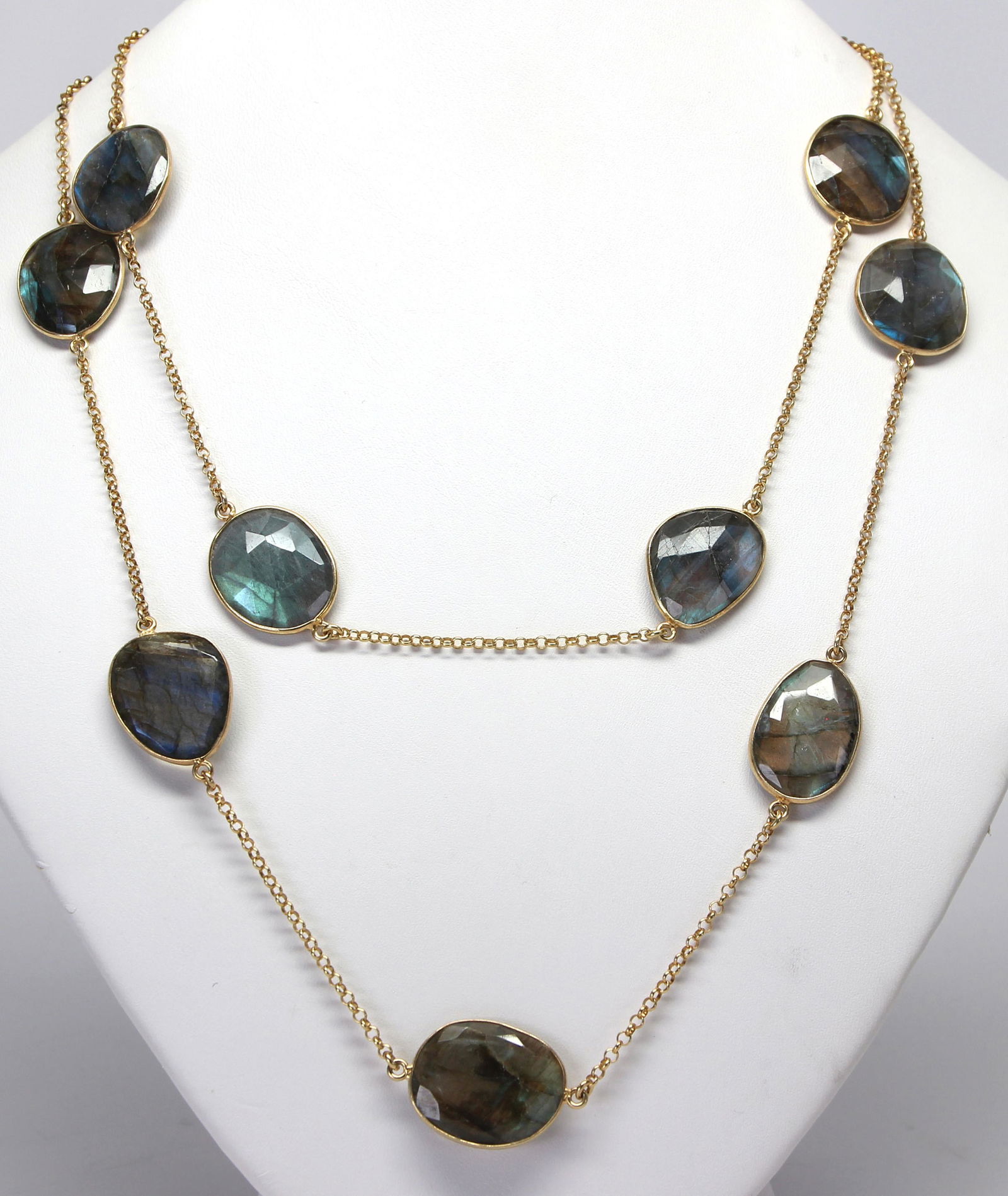 Labradorite, silver-gilt link necklace: Labradorite, silver-gilt link necklaceComposed of (15) irregular, faceted-top labradorite cabochons, measuring approximately 20 X 17 mm, set and linked in silver-gilt, forming a continuous 36 inch nec