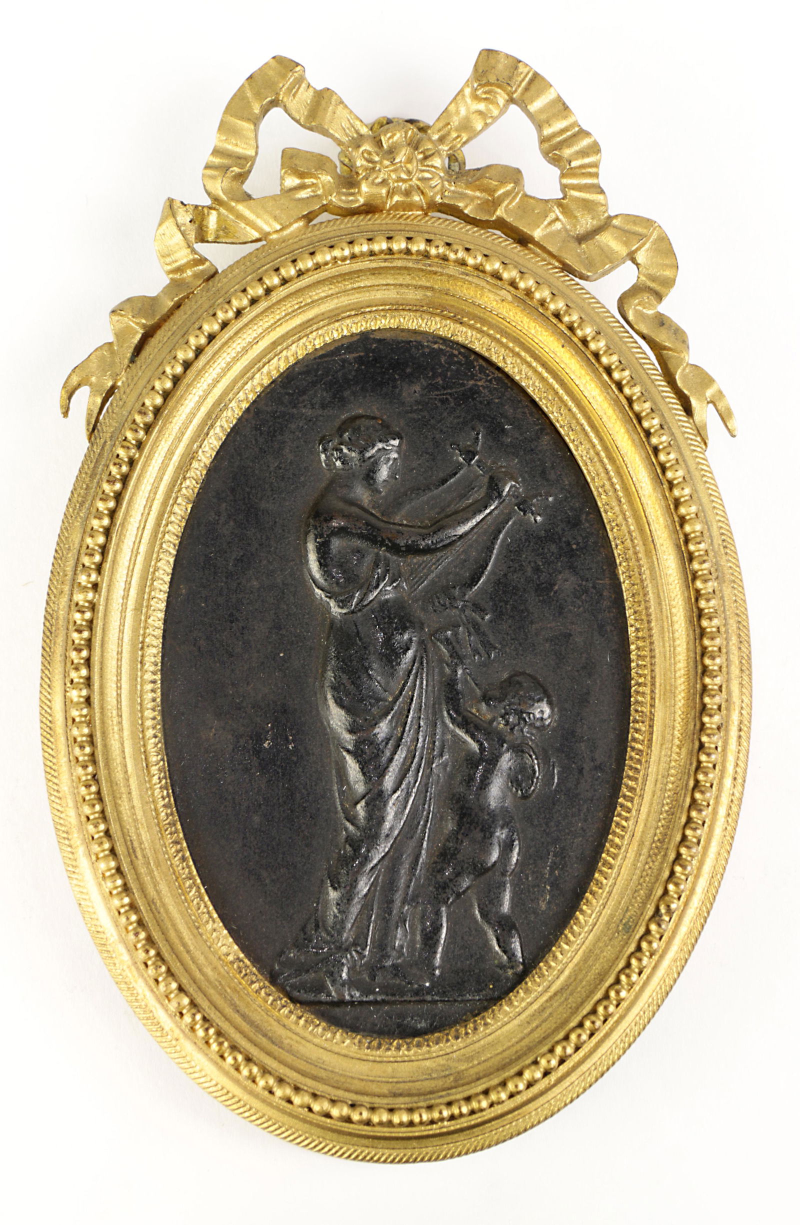 A framed cast iron mythological plaque (1 of 2)