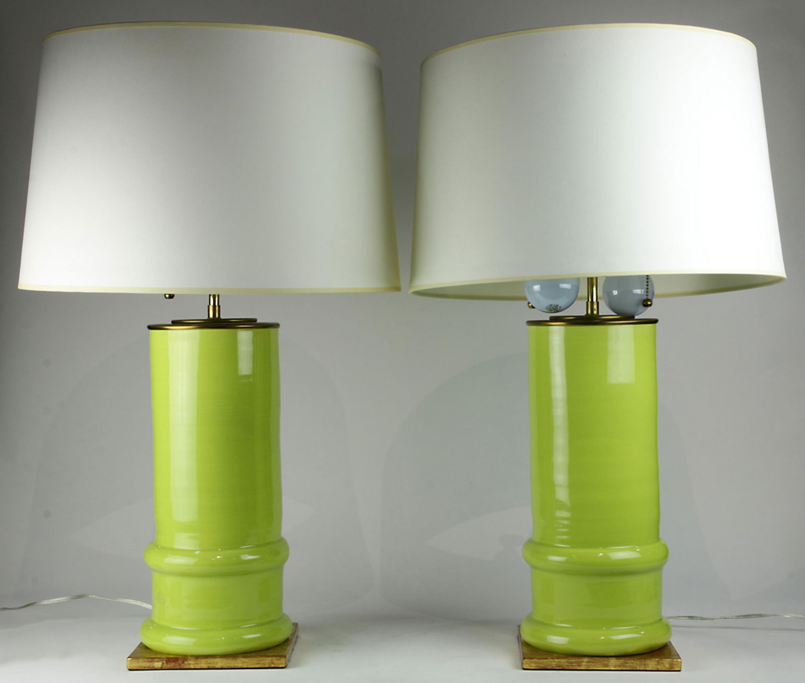 A pair of Christopher Spitzmiller chartreuse table (1 of 2)