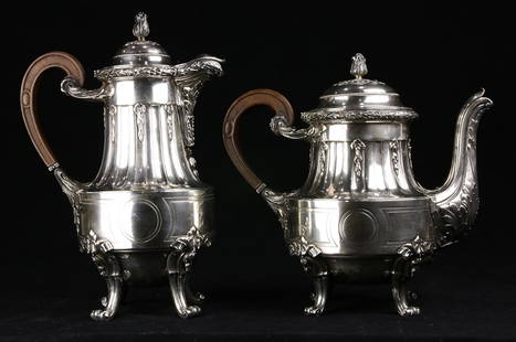 (lot of 2) A French Robert Linzeler silver tea and: (lot of 2) A French silver tea and coffee set, Robert Linzeler, each waisted ovoid form, cast with a fluted neck and a rais-de-coeur border, the hinged lid with a berried floriform finial and fitted w