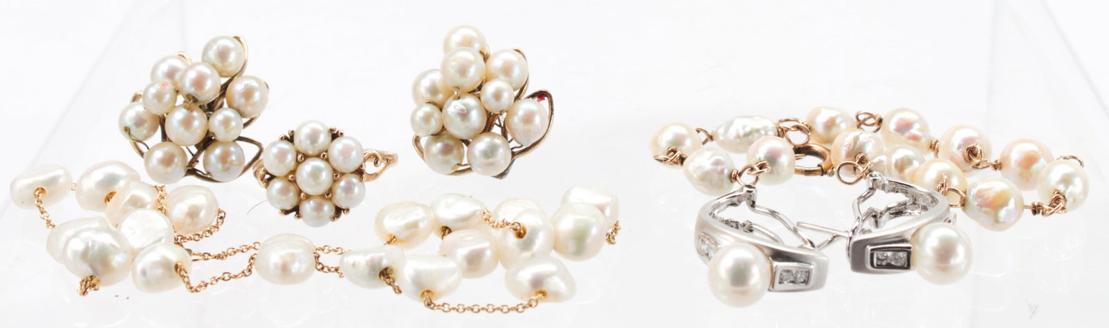 Cultured pearl, diamond, gold jewelry suite: Cultured pearl, diamond, gold jewelry suite Including 1) necklace, featuring (19) baroque, fresh water cultured pearls, measuring approximately 7.5 X 4.5 mm, linked by 14k yellow gold, completed by a 