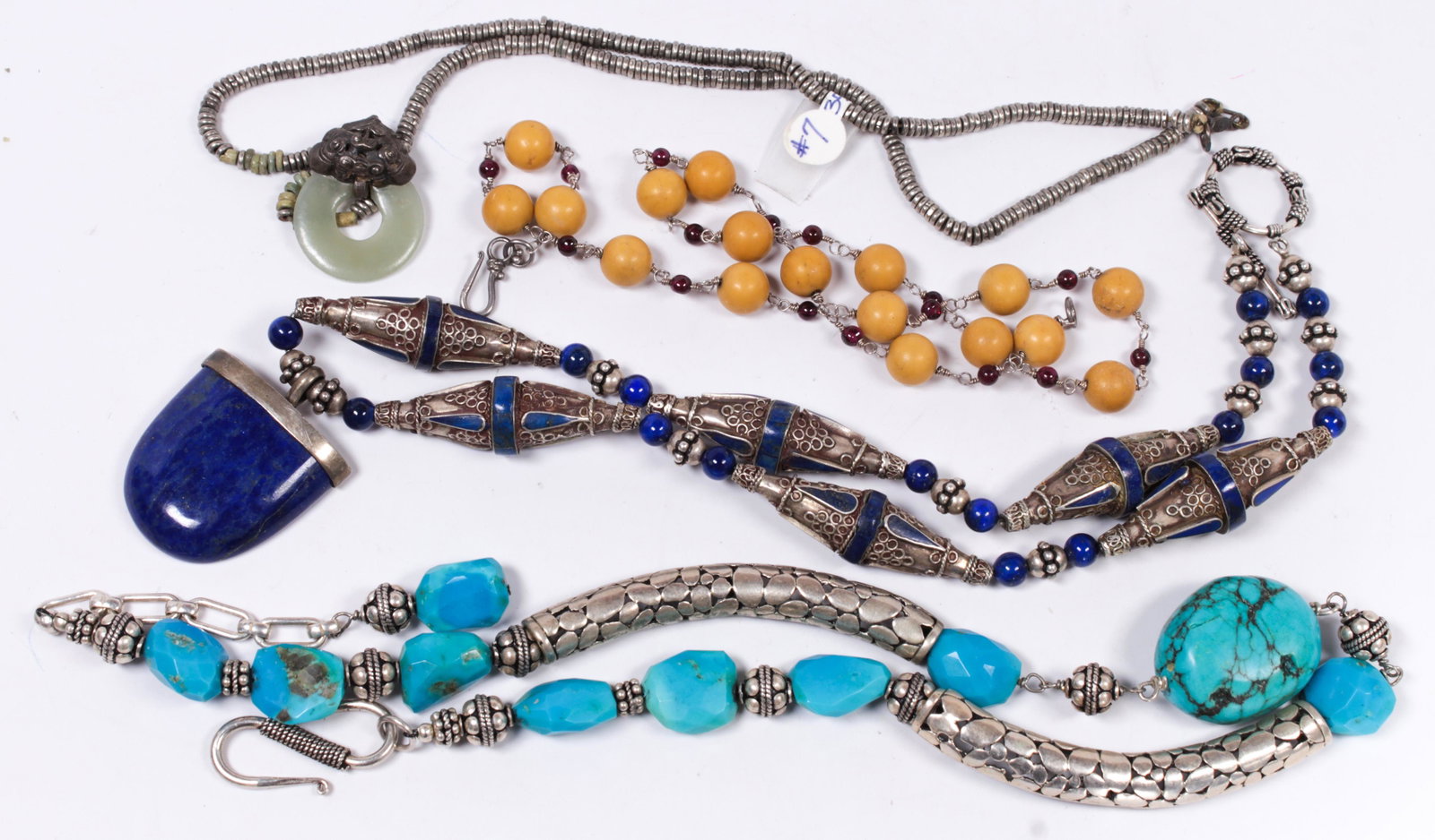 (Lot of 4) Multi-stone, silver, metal necklace: (Lot of 4) Multi-stone, silver, metal necklace Including 2) lapis lazuli and turquoise, silver necklace; 1) serpentine disc, silver, metal necklaces; together with 1) bone, garnet bead, metal necklace