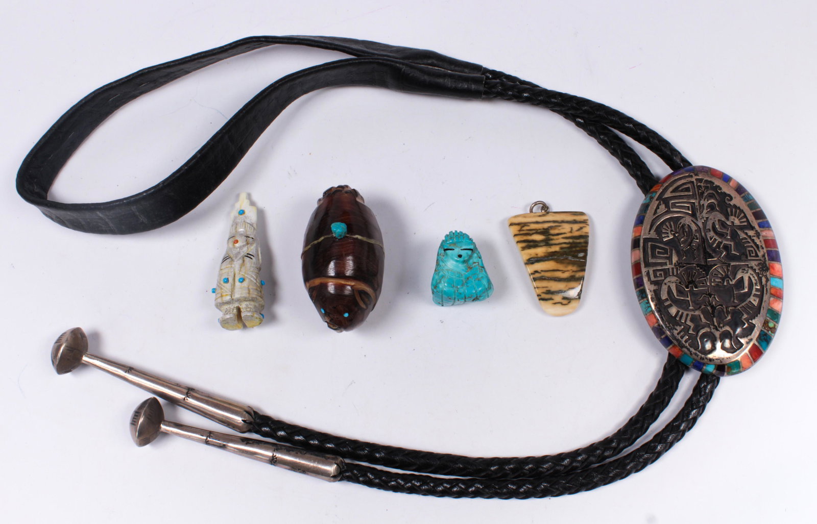 Collection of multi-stone, silver, metal jewelry items: Collection of multi-stone, silver, metal jewelry itemsIncluding 1) Lonn Parker, turquoise, lapis lazuli, sugilite, spiny oyster, silver Kokopelli bolo, measuring approximately 76 X 53 mm, attached to