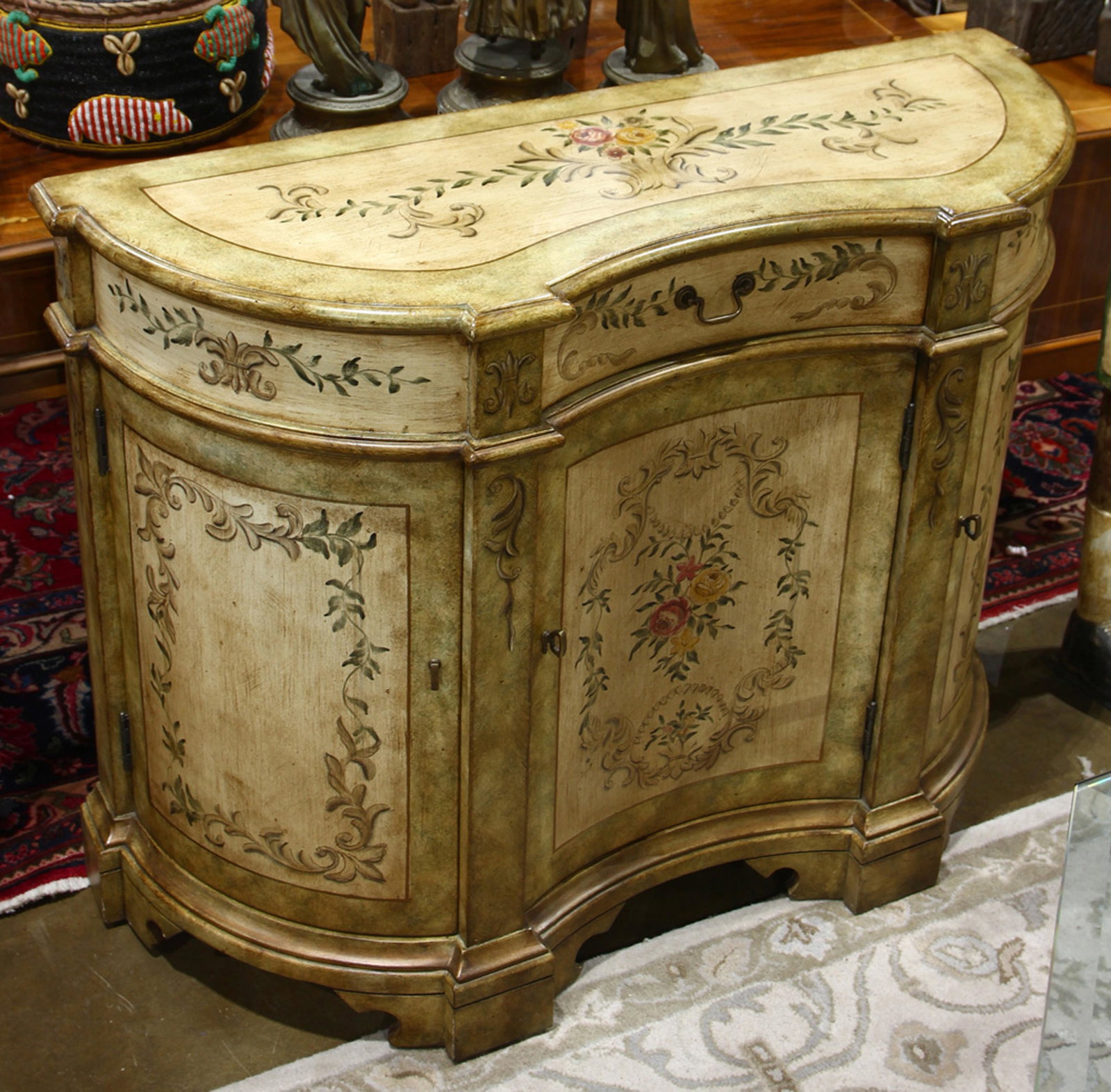 Rococo style polychrome decorated chest: Rococo style polychrome decorated chest, having floral decorated reserves, 34"h x 44"w x 16.5"d