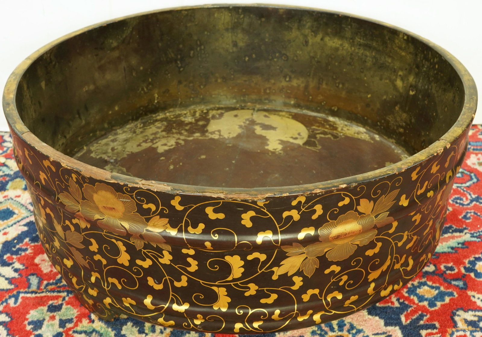 A Massive Japanese ebonized lacquer wood basin: A Massive Japanese ebonized lacquer wood basin decorated with peonies, 8"h x 20.5"d