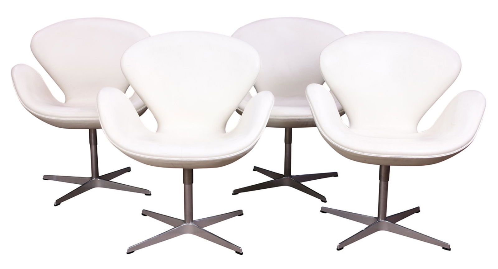 A group of Arne Jacobsen for Fritz Hansen swan chairs: (lot of 4) Arne Jacobsen for Fritz Hansen swan chairs, each having a white leather swivel seat, above a chrome base, each labeled "House of Fritz Hansen, 2008," 33"h