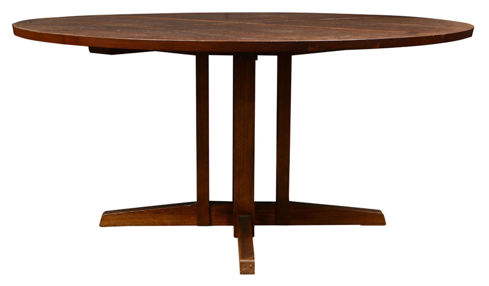 A George Nakashima (1905-1990) walnut Frenchman: A George Nakashima (1905-1990) walnut Frenchman's Cove dining table circa 1963, having three rosewood butterfly keys and rising on a pedestal base, 28.5"h x 60"w Note: sold with copy of the original o
