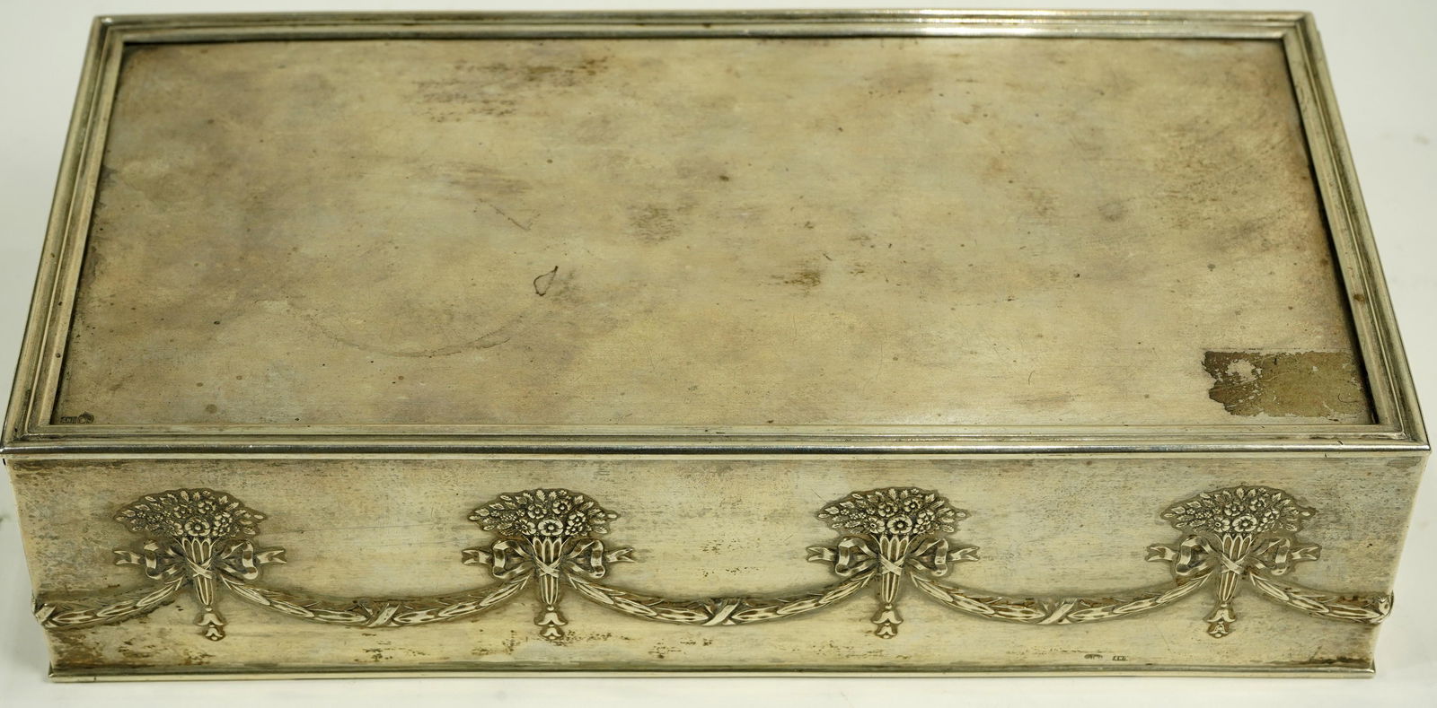 Russian .84 silver cigar box, executed in the: Russian .84 silver cigar box, executed in the Neoclassical taste, possibly 19th century, the top opening to a wood lined interior, the body with garland swag detail, each marked 84 with Cyrillic monog