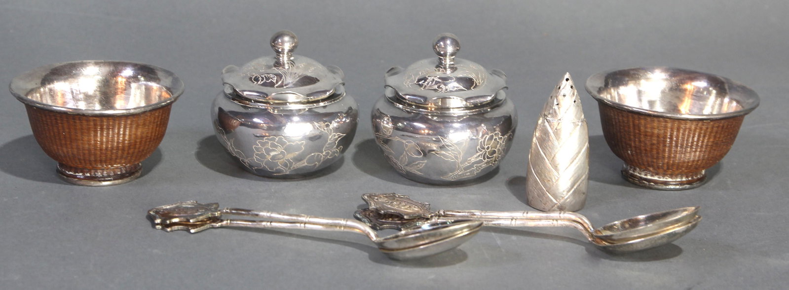 (lot of 8) Chinese silver table items: (lot of 8) Chinese silver table items, comprising two salts, a pinecone form Chinese export Cumshing salt shaker, (4) CC Silversmiths souvenir demitasse spoons inscribed "The Royal Hong Kong Golf Club