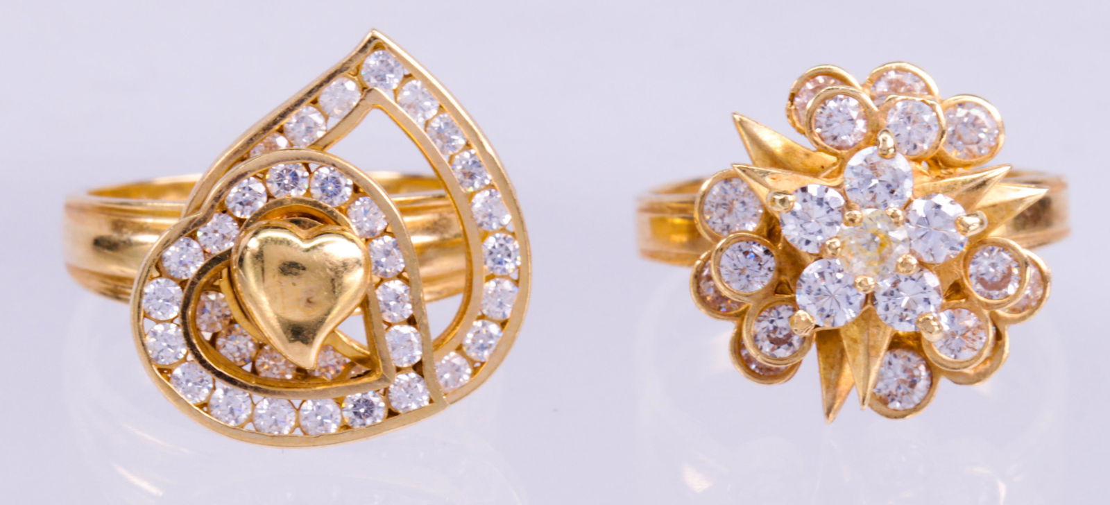 (Lot of 2) White stone, 14k yellow gold kinetic rings (1 of 3)