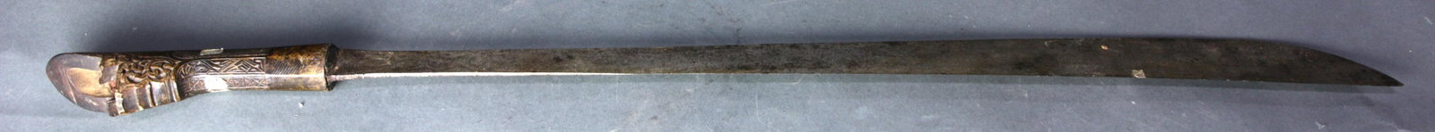 Indonesian carved finial on a sword: Indonesian carved finial on a sword, 31"h, Provenance: Richard I.M. Kelton Collection, Marina del Rey, California