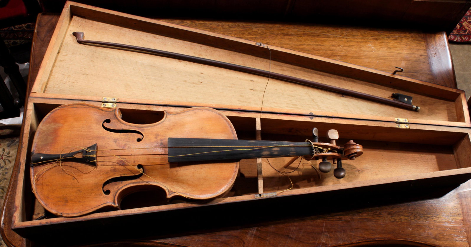 Violin and bow with ebonized wood carrying case, violin: Violin and bow with ebonized wood carrying case, violin 23"l