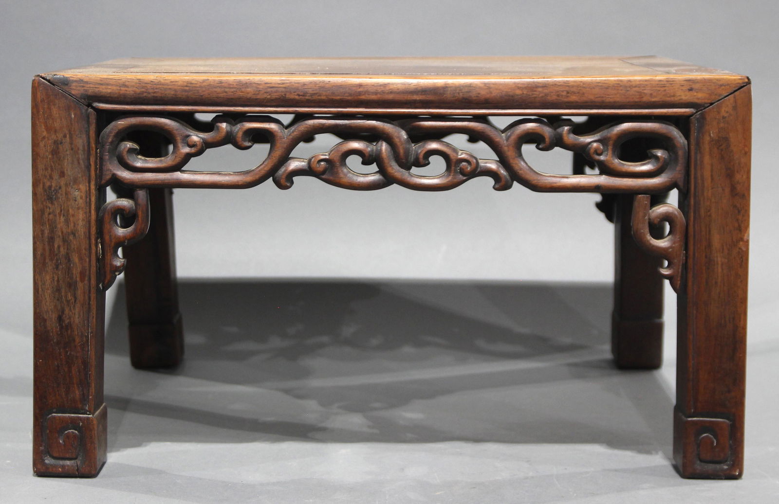 Small Chinese hardwood low table decorated with leafy (1 of 2)