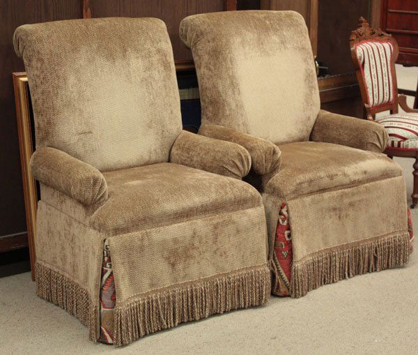 high back arm chairs: Pair of high back club chairs having a rolled back upholstered in mocha velvet with a small block pattern and Kelim back panels and corner pleats