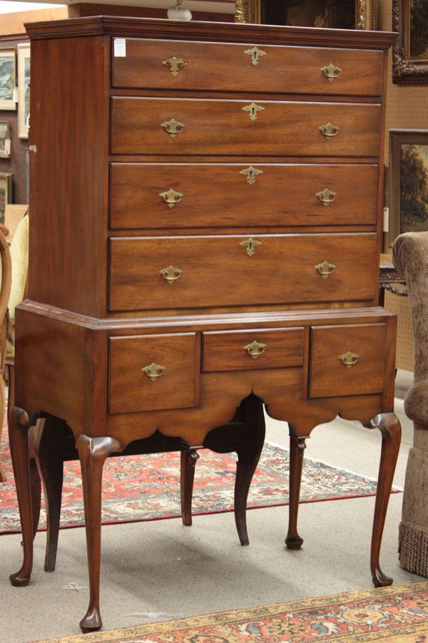 Kittinger mahogany highboy: Queen Anne style Kittinger mahogany highboy bearing Kittinger, Buffalo label and branded, having four drawer top above three drawers and shaped apron