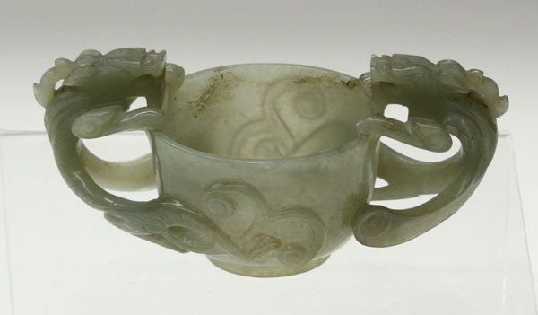 Chinese Small Nephrite Libation Cup: Chinese small nephrite jade libation cup, bracketed by a pair of large chilong-form handles with the bodies issuing from the curved body supported on a short ring foot, the translucent olive green mat