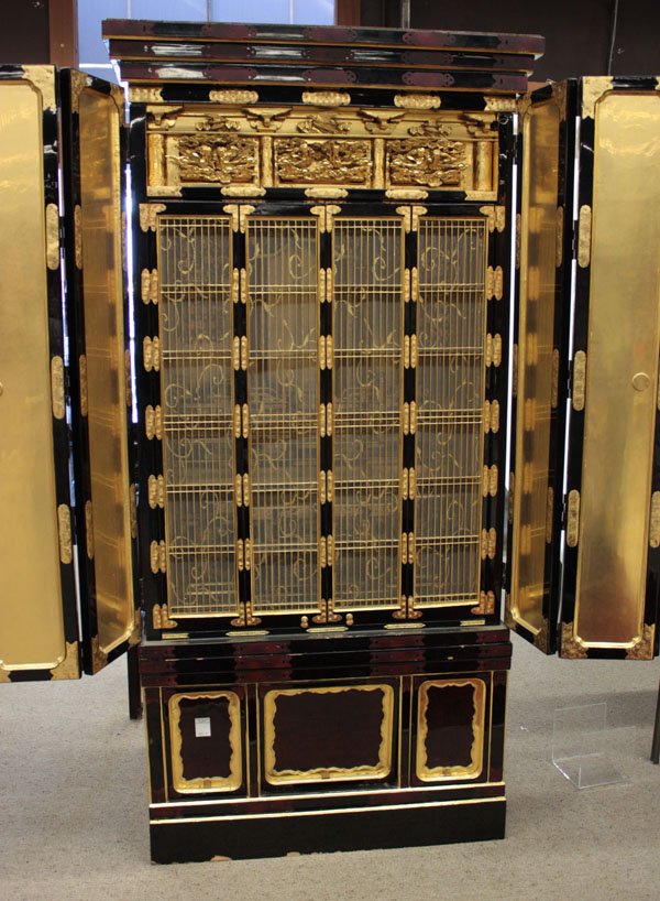 Japanese Gilt/Black Lacquer Butsudan: Japanese gilt and black lacquer butsudan (cabinet for Buddhist worship), probably Meiji period, the folding double doors opening to a second set of doors with silk-backe lattice work and a lavish gilt