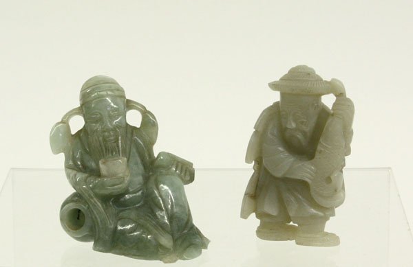 Chinese Jade Figurines, Fisherman/Sage: (lot of 2) Chinese jade figural carvings, the first of a fisherman wearing a straw cape and holding a large fish, the translucent stone of celadon green tone with a few inclusions, the second of a Chi