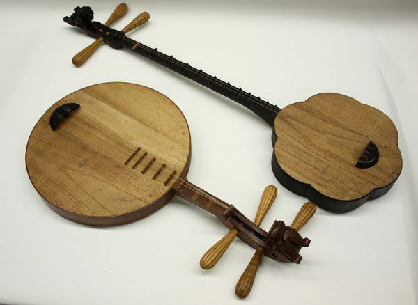 chinese stringed instrument played with padded bamboo chinese stringed instrument played with padded bamboo