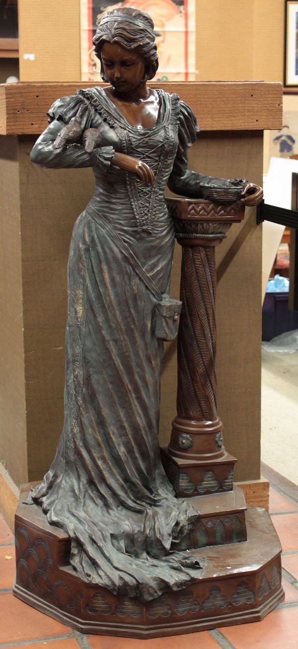 Patinated bronze figural sculpture