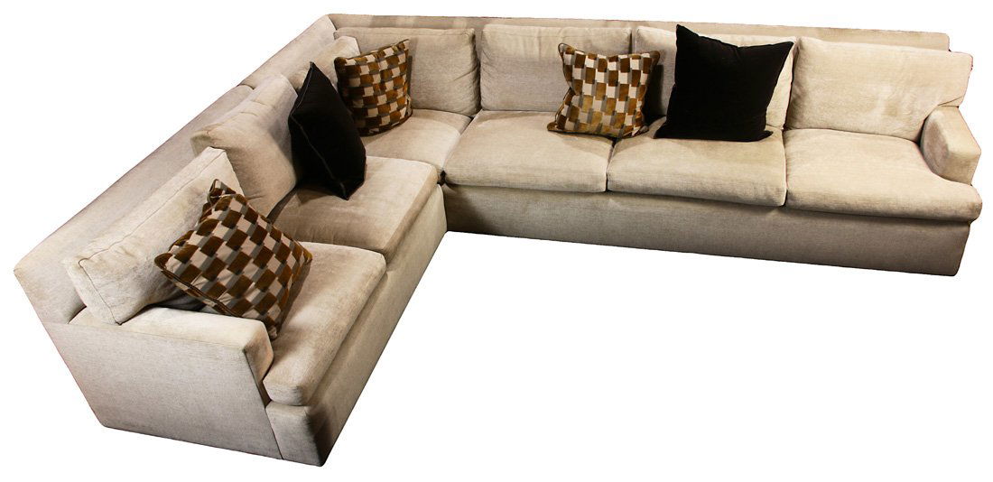 A Contemporary four seat sofa: A contemporary sectional sofa, having a square profile with taupe upholstery, 34"h x 11'10.5"w