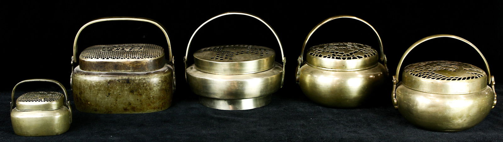A lot of (5) Chinese patinated silver metal handwarmers: A lot of (5) Chinese patinated silver metal handwarmers, each of compressed ovoid or rectangular form with rounded edges, one each with a bat or bird perforated tops, three others with cut out and eng