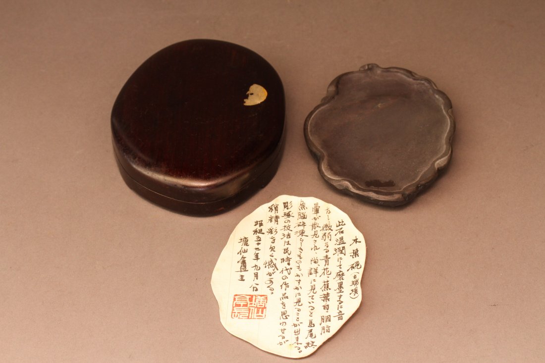 A Chinese Leaf-Shaped Duan Inkstone: A Chinese Leaf-Shaped Duan Inkstone, with a smoothly polished grinding surface, the reverse side incised with a leaf pattern, with a hardwood box and a letter from a previous collector. Dimensions: 0.