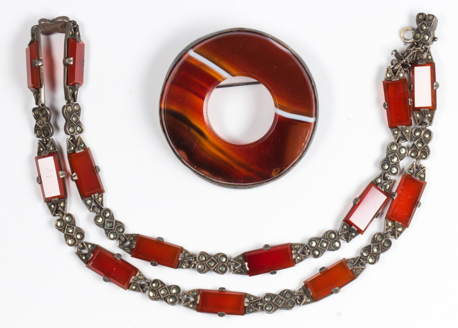(Lot of 2) Agate, sterling silver, silver jewelry: (Lot of 2) Agate, sterling silver, silver jewelry Including 1) agate circle, silver brooch, measuring approximately 43 X 5 mm; together with 1) carnelian, marcasite, sterling silver 16 inch necklace, 