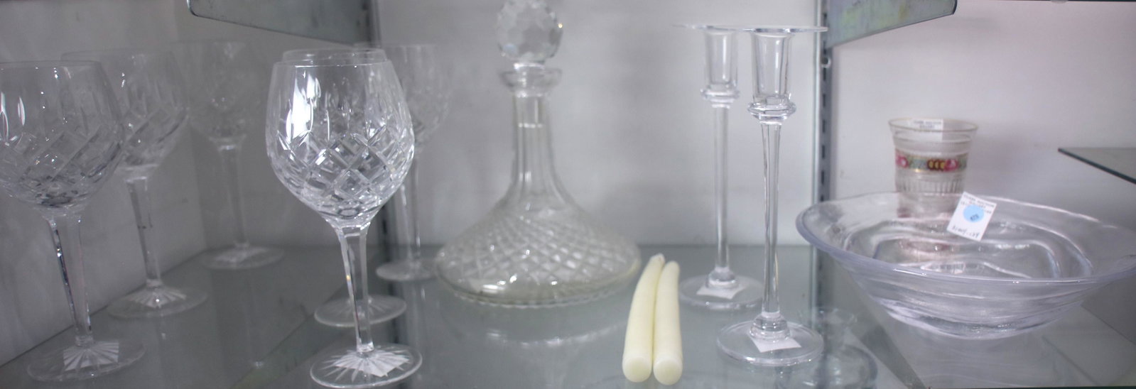 (lot of 11) Stemware group: (lot of 11) Stemware group, consisting of (6) Waterford red wine goblets, a decanter, together with a pair of Simon Pearce candlesticks and a centerbowl, and an Antique spa glass tumbler, goblets: 8"h