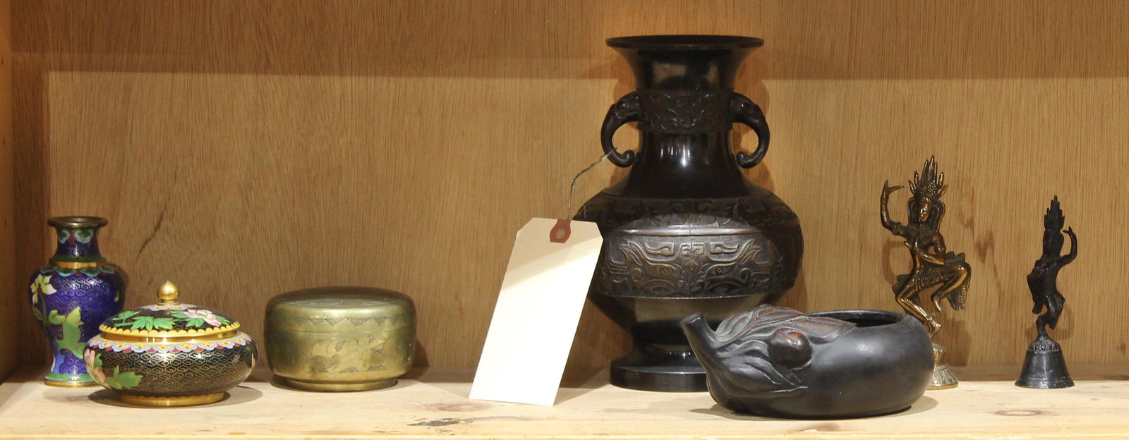 One shelf with Asian metalwork (1 of 1)