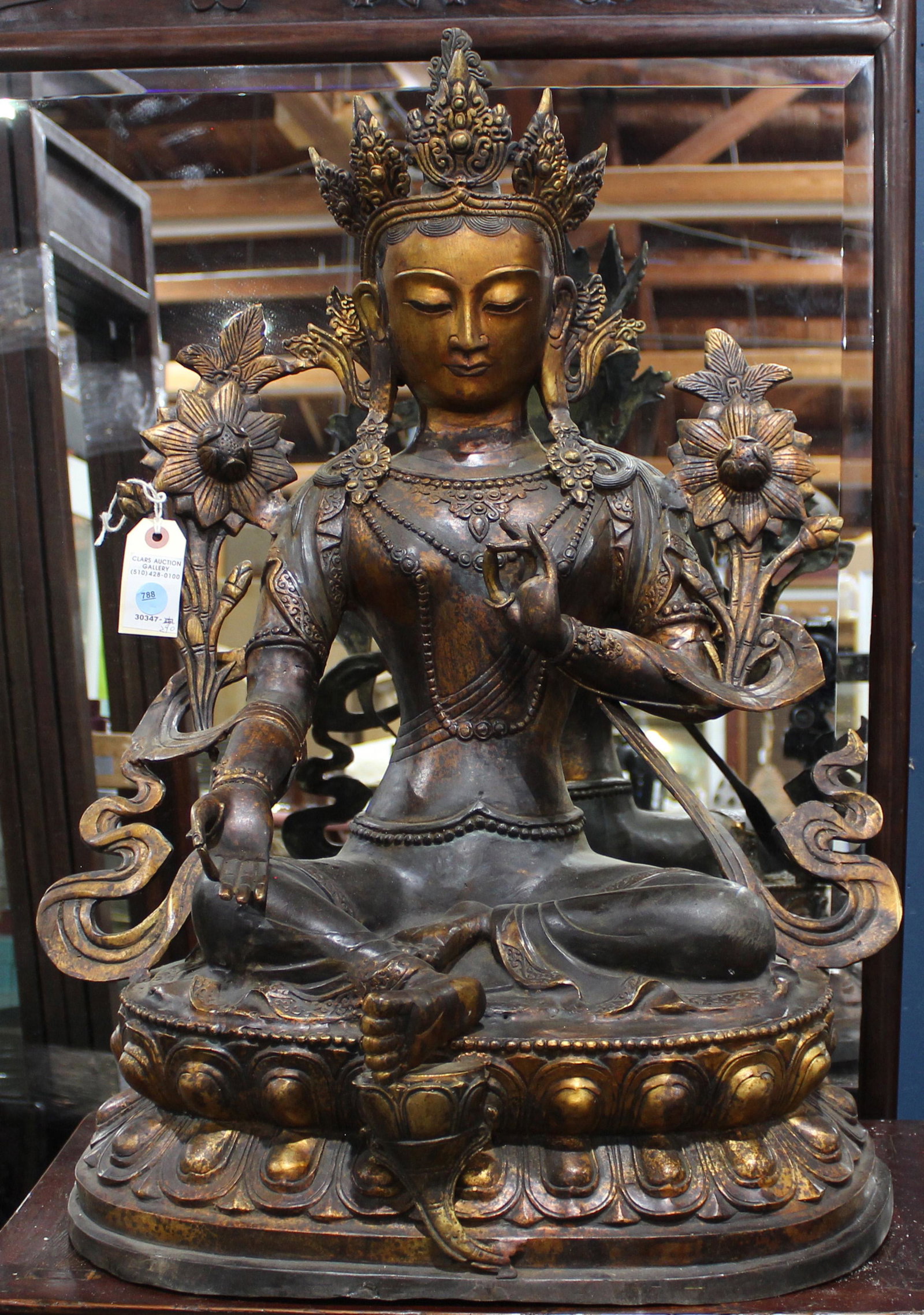 A Chinese Gilt Bronze Figure of Bodhisattva Tara: A Chinese Gilt Bronze Figure of Bodhisattva Tara (green), the figure is cast seated in dhyanasana on a double-lotus base with a beaded rim, her right hand is lowered in varada mudra and her left hand 