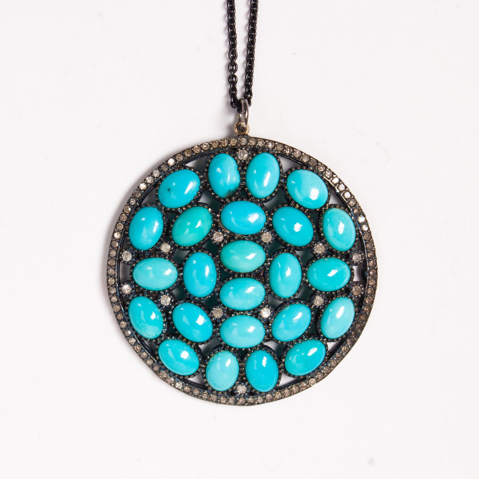 A turquoise, diamond and blackened silver pendant (1 of 2)