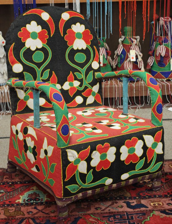 Beaded chair, Yoruba tribe, Nigeria: Beaded chair, Yoruba tribe, Nigeria, with floral design and black backrest, 35''h x 25''w x 31''d