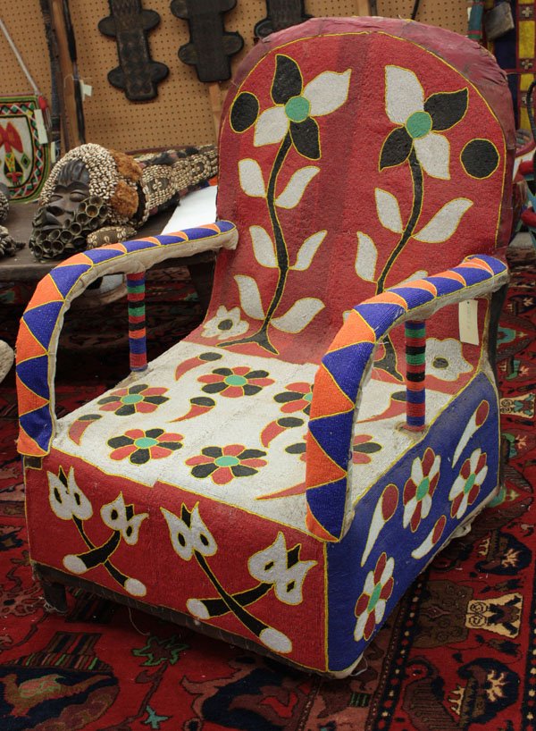Beaded chair, Yoruba tribe, Nigeria: Beaded chair, Yoruba tribe, Nigeria, with floral design and red backrest, 37''h x 24''w x 30''d