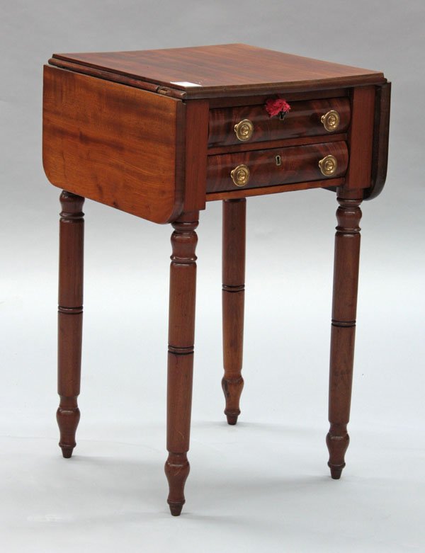 American Sheraton mahogany work table: American Sheraton/Empire transitional mahogany two drawer work table, circa 1820, with drop leaf and turned legs, 29''h x 18''w x 16.5''d