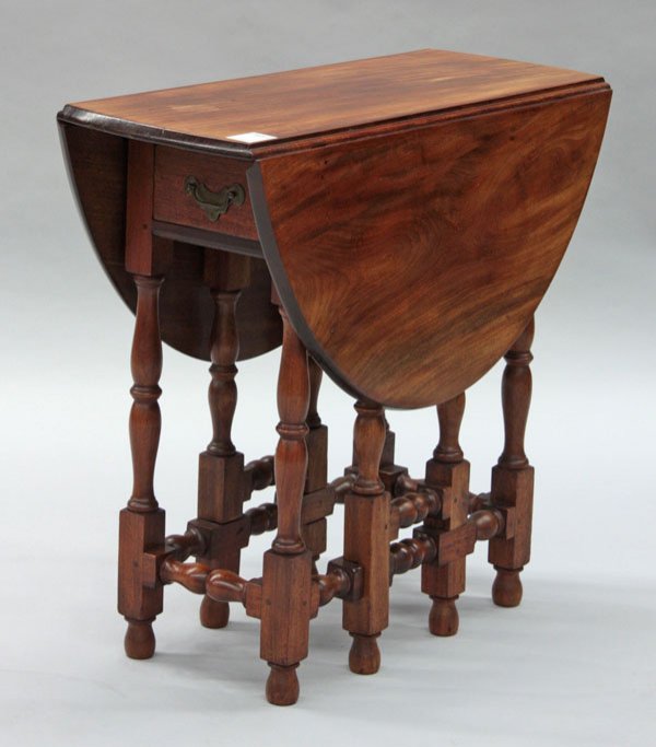 William & Mary style walnut table: Diminutive Southern States William & Mary style walnut gate-leg table, circa 1800, drop leaf over turned base with frieze drawer, 25''h x 27''w x 11.5''d (35.5'' extended)