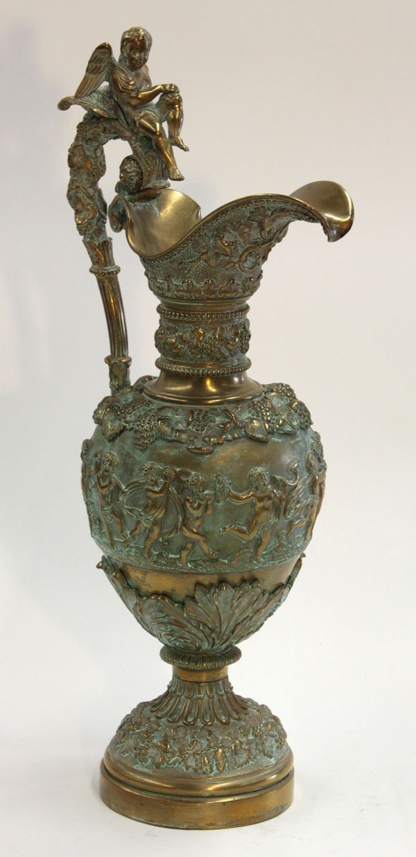 Dore Roman Revival ewer: Dore Roman Revival ewer, circa 1870, having winged cherub handle ending in ram's head and overall Bacchanalian grape and vine motif, 22''h
