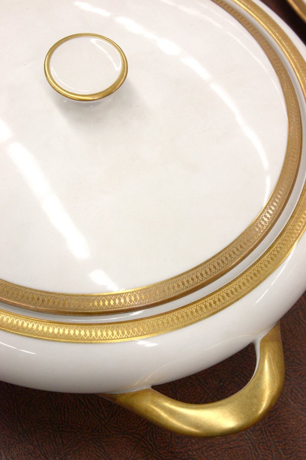 Tirschenreuth Bavaria dinnerware: Extensive Tirschenreuth Bavaria porcelain table service in ivory with gilt enameled border consisting of thirty-six dinner plates, thirty-six salad plates, twelve soup bowls, 19 consommes, twenty sauc