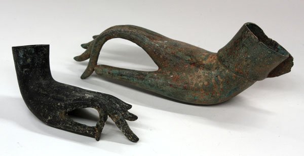 Southeast Asian Bronze Buddha Hands: (lot of 2) Southeast Asian bronze hands of the Buddha, Thai, each in the abhaya mudra (gesture of reassurance), the first possibly 18th century and cast with a stylized floral roundel to the center of