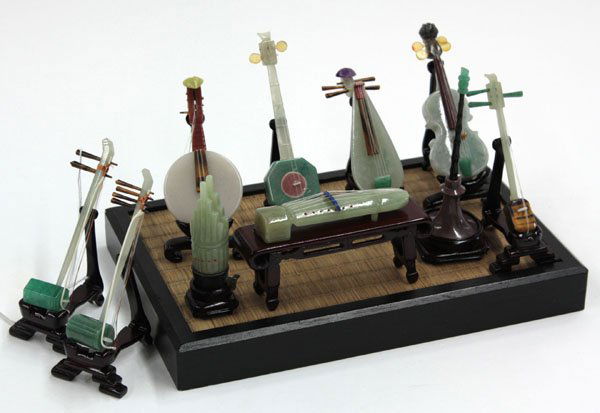 Chinese Miniature Stone Instruments: (lot of 10) Set of Chinese miniature stone models of traditional instruments, featuring qin, mouth organ, horn, pipa, erhu and other types of string instruments, each fashioned from various types of s