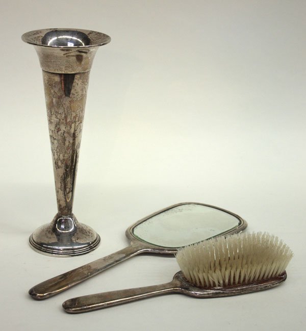Sterling silver Empire vase brush: (lot of 3) Sterling silver items including an Empire trumpet form vase with slightly flaring mouth, weighted round pedestal base, 9.5''h, and an American made dresser set with brush and hand mirror, m