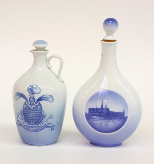 Bing & Grondahl wine jug: (lot of 2) Bing & Grondahl blue and white ''Cherry Heering'' cork stoppered wine jug featuring the Peter F. Heering crest, 8''; together with a Royal Copenhagen cork stopperd decanter with a central r