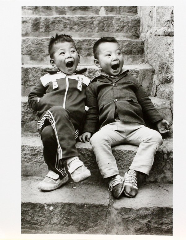 Photograph, Gangfeng Wang, Chinese: Unframed photograph, Two Children, 1986, by Gangfeng Wang (Chinese, Contemporary), signed and dated and inscribed ''Wang Gangfeng / 1986 / Fusian China'' lower right, overall: 12''h x 10''w.