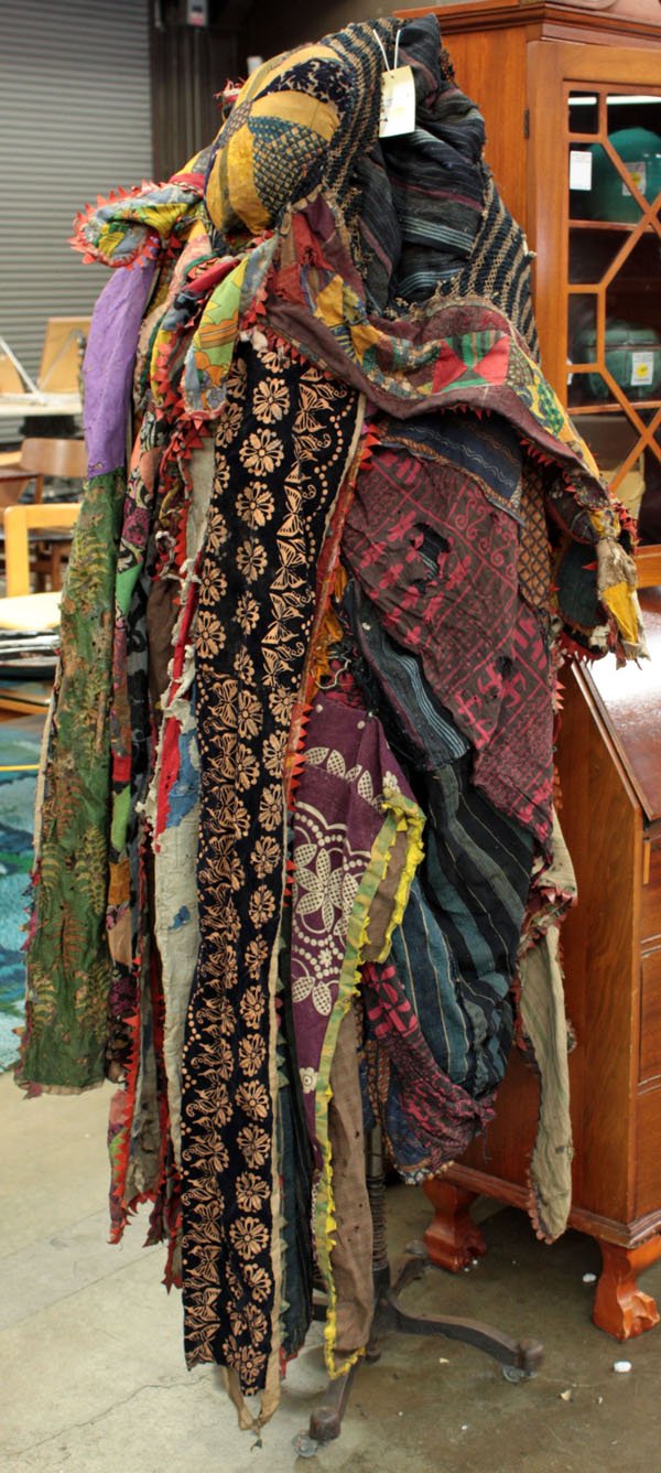 Ritual textile Yoruba tribe, Nigeria: Ritual textile 'Igungun,' Yoruba tribe, Nigeria, a patchwork of colorful fabrics cascading from a round cap, 52''l
