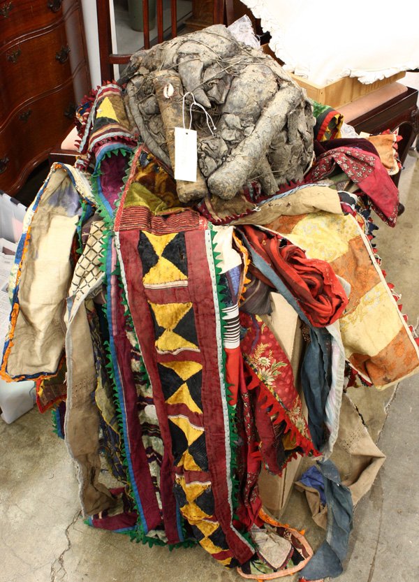 Ritual textile Yoruba tribe, Nigeria: Ritual textile 'Igungun,' Yoruba tribe, Nigeria, a patchwork of colorful fabrics cascading from a fetish conglomeration, approx. 58''l
