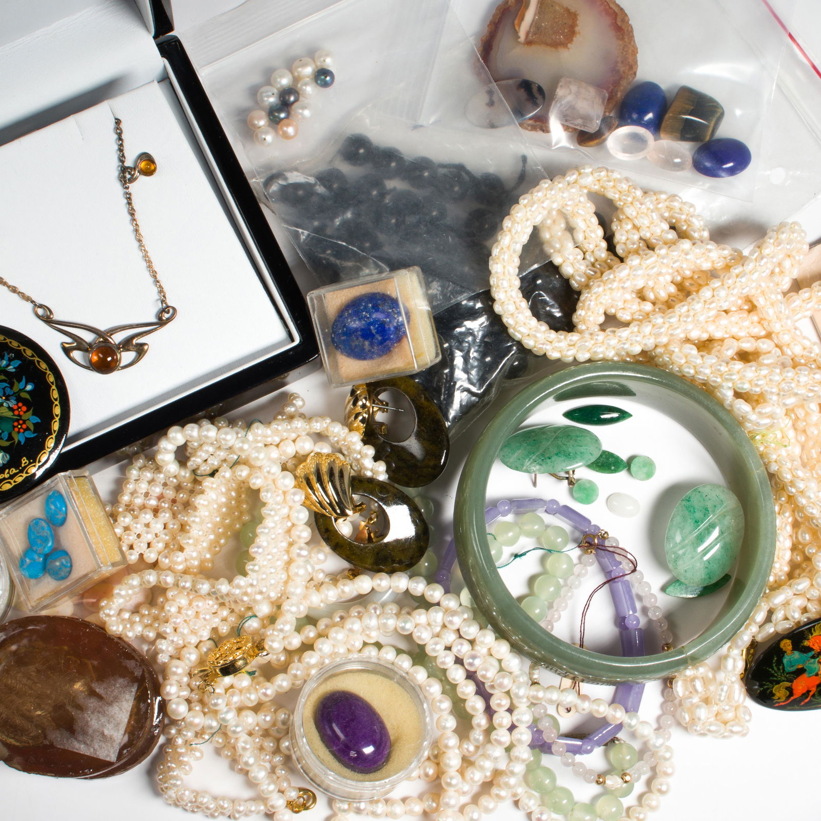 A collection of multi-stone, gold and metal jewelry (1 of 1)