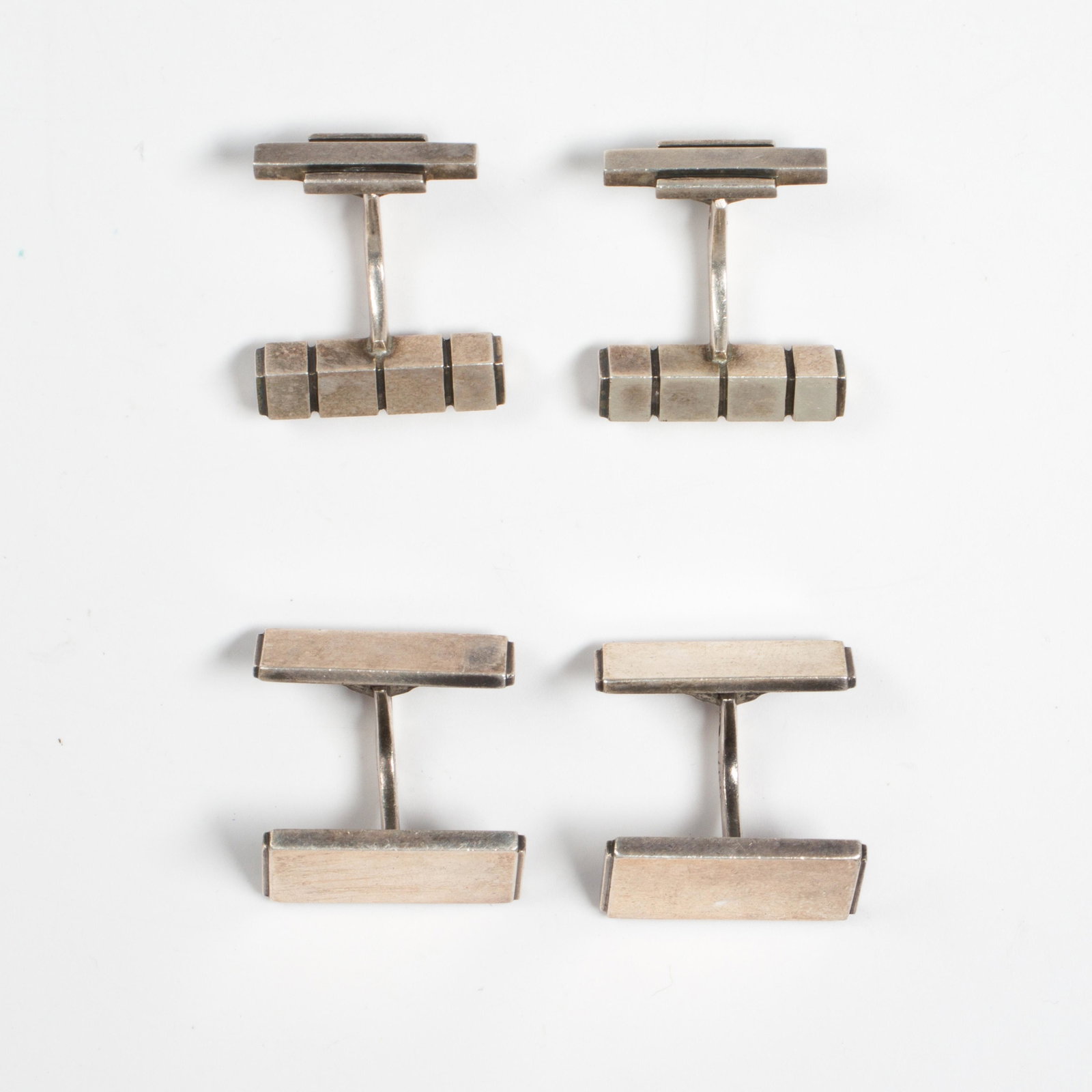 A group of sterling cufflinks, Georg Jensen: A group of sterling cufflinks, Georg Jensen including two pairs. Gross weight: 32.7 gs.; Length: 7/8".