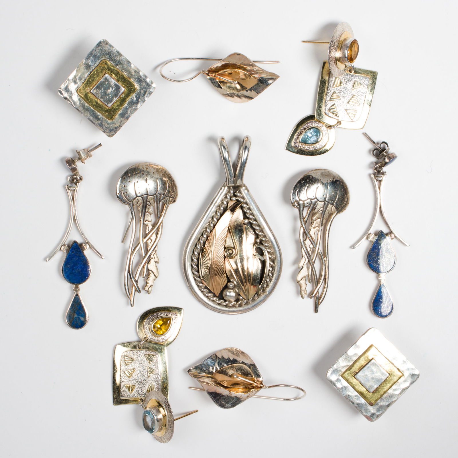 A group of silver earrings and a pendant (1 of 1)